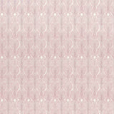 Detail of wallpaper in an art deco damask print in pink on a white field.