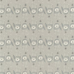 Detail of wallpaper in a playful hamsa hand print in cream and gray on a tan field.