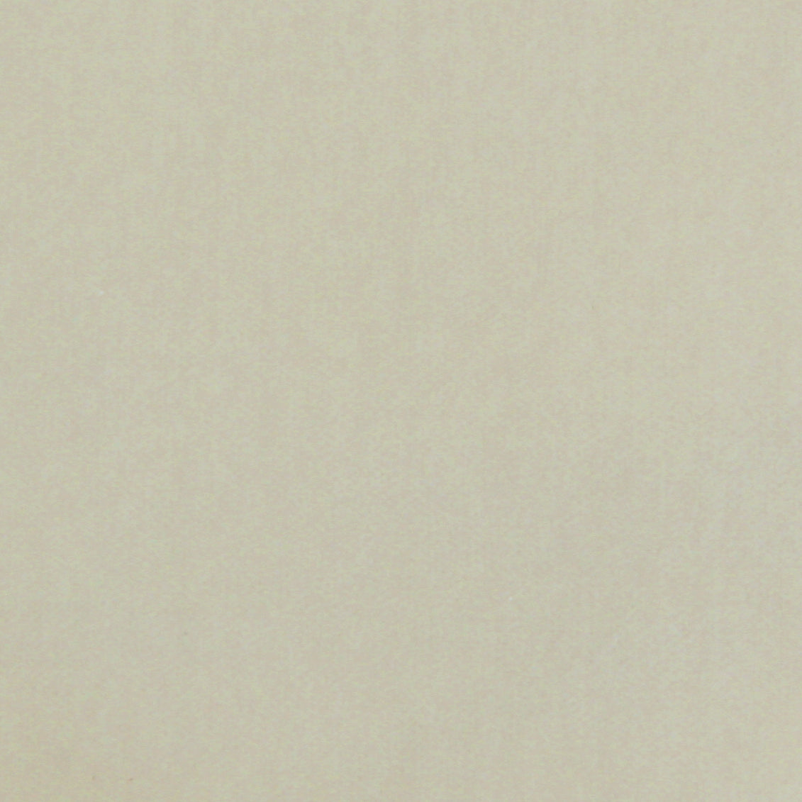 Detail of velvet fabric yardage in ivory.