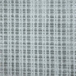 Broadloom carpet in a textural grid in cool grey.