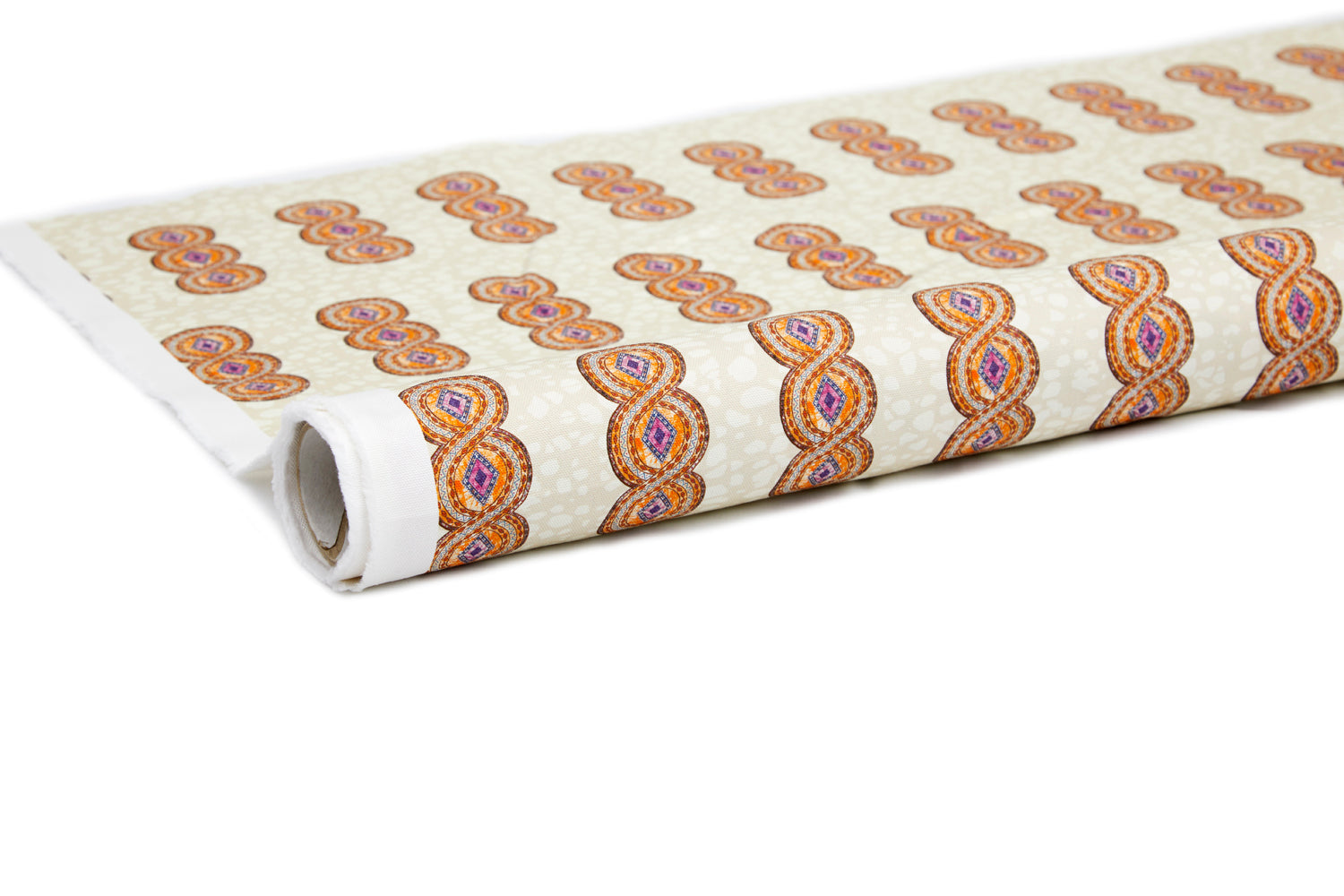 Partially unrolled fabric in an intricate curvilinear print in shades of red, orange and pink on a cream field.