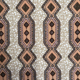Patterned fabric with geometric design on a beige background