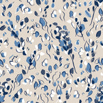 Detail of wallpaper in a painterly leaf print in shades of navy and white on a tan field.