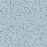 Detail of wallpaper in a minimalist floral print in navy on a blue field.