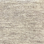 Textural bouclé broadloom carpet in soft taupe.