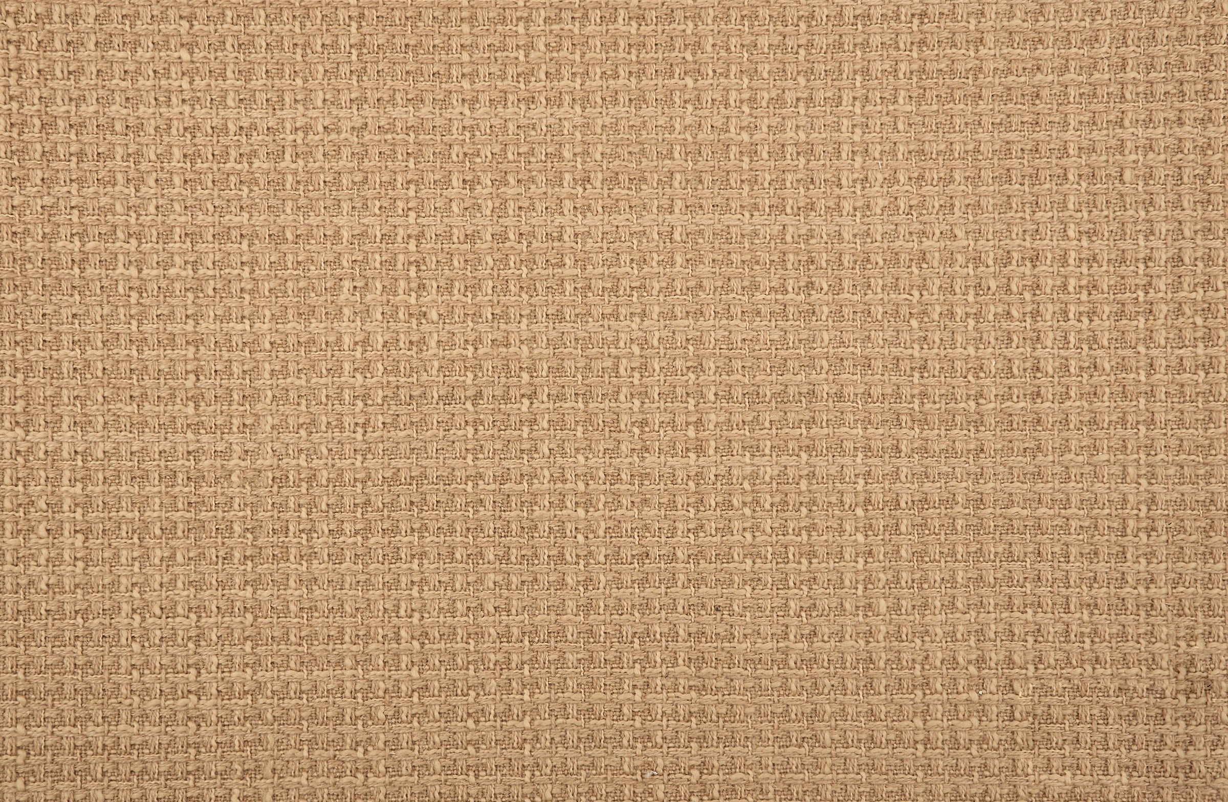 Broadloom carpet in solid woven texture in  light brown.