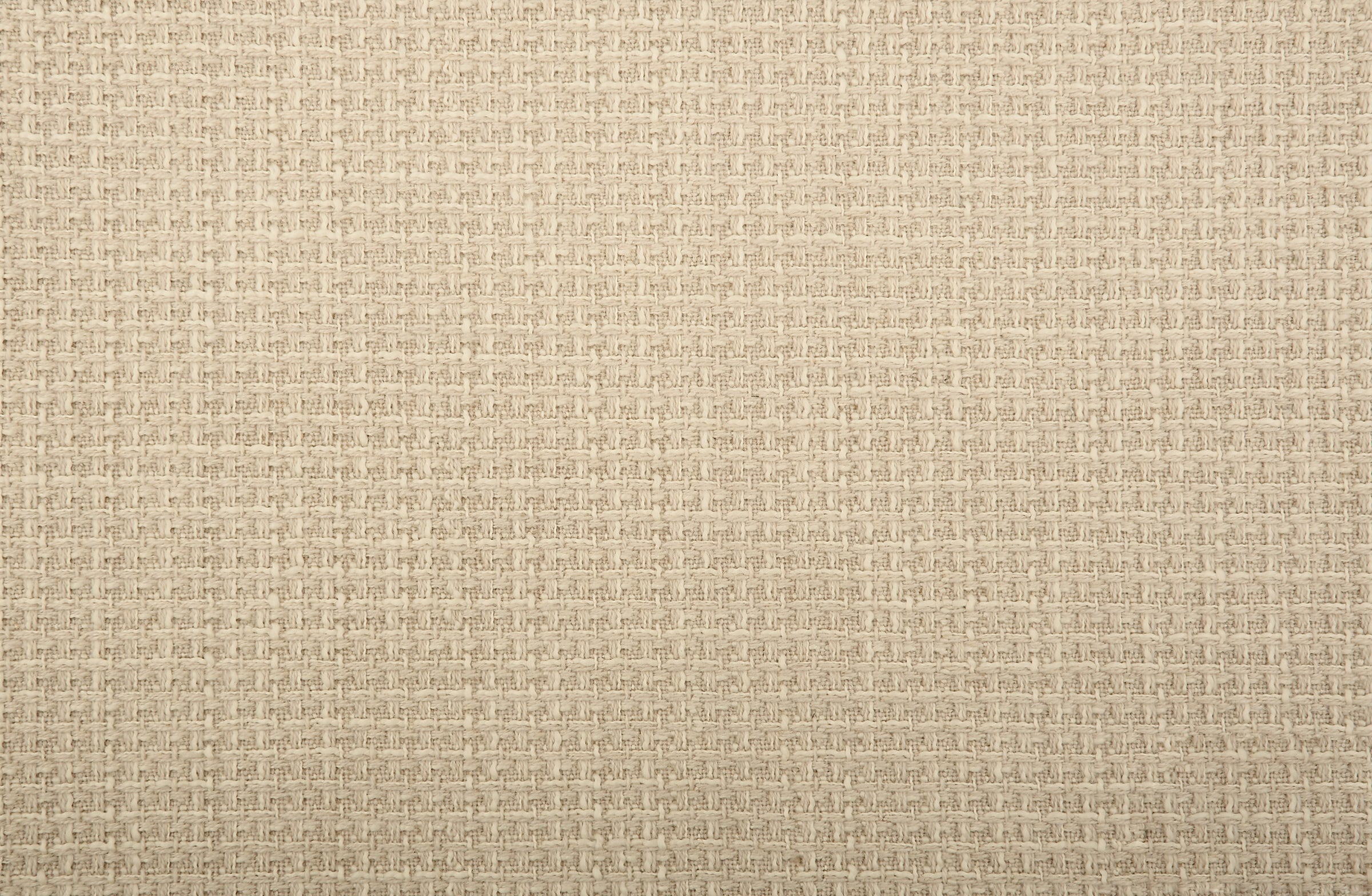 Broadloom carpet in solid woven texture in oatmeal. 
