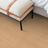 Bedroom scene with a solid textural carpet in warm brown. 