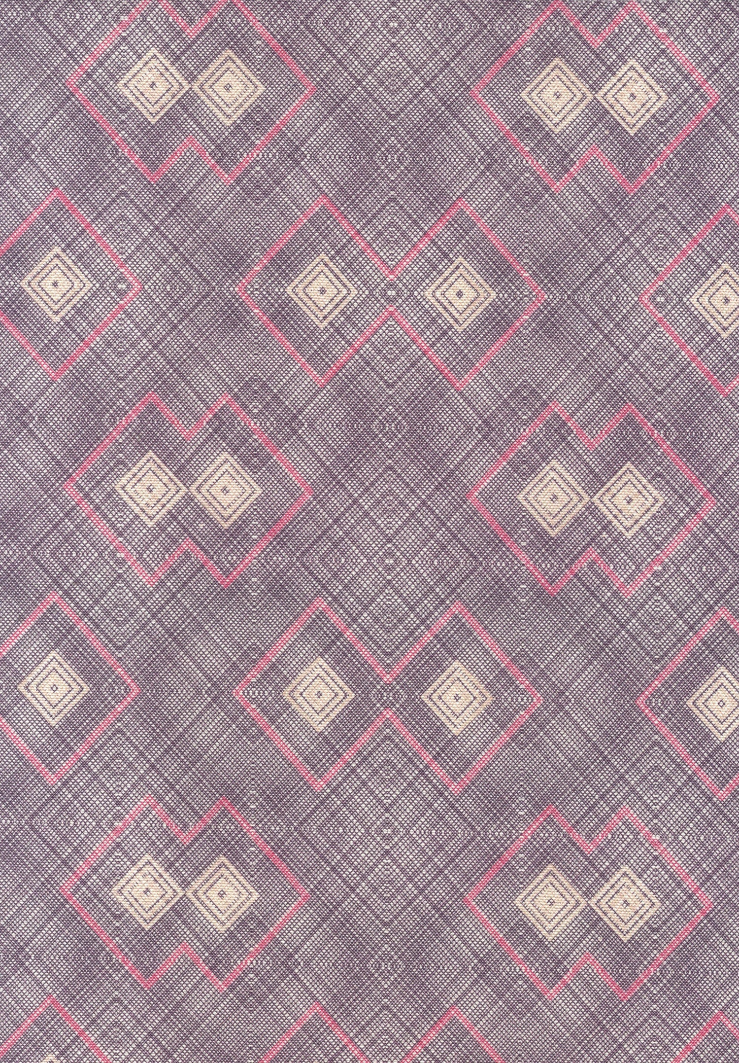 Detail of fabric in a detailed diamond lattice print in shades of pink and tan on a purple field.