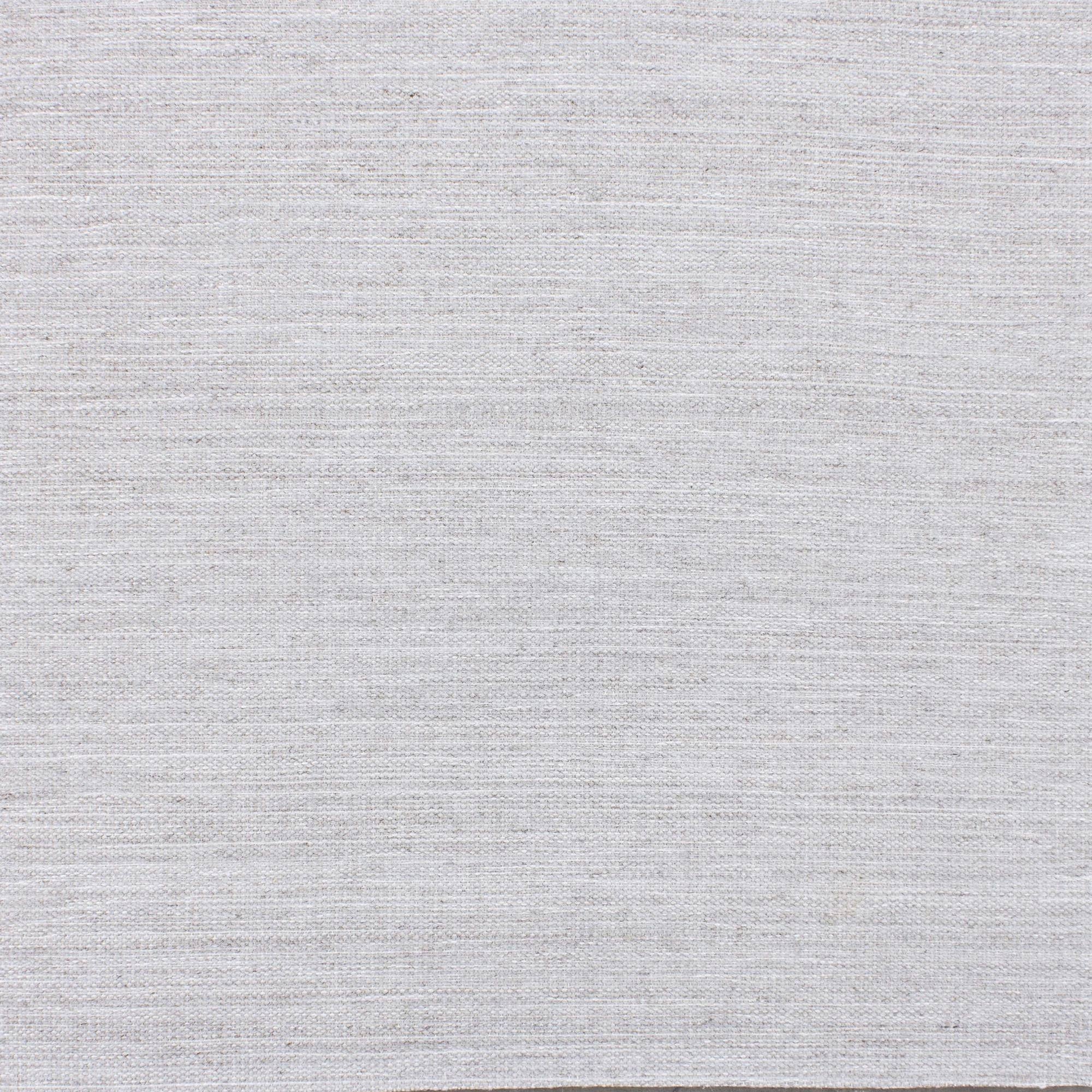 Broadloom carpet in a subtle textural solid in cool white.