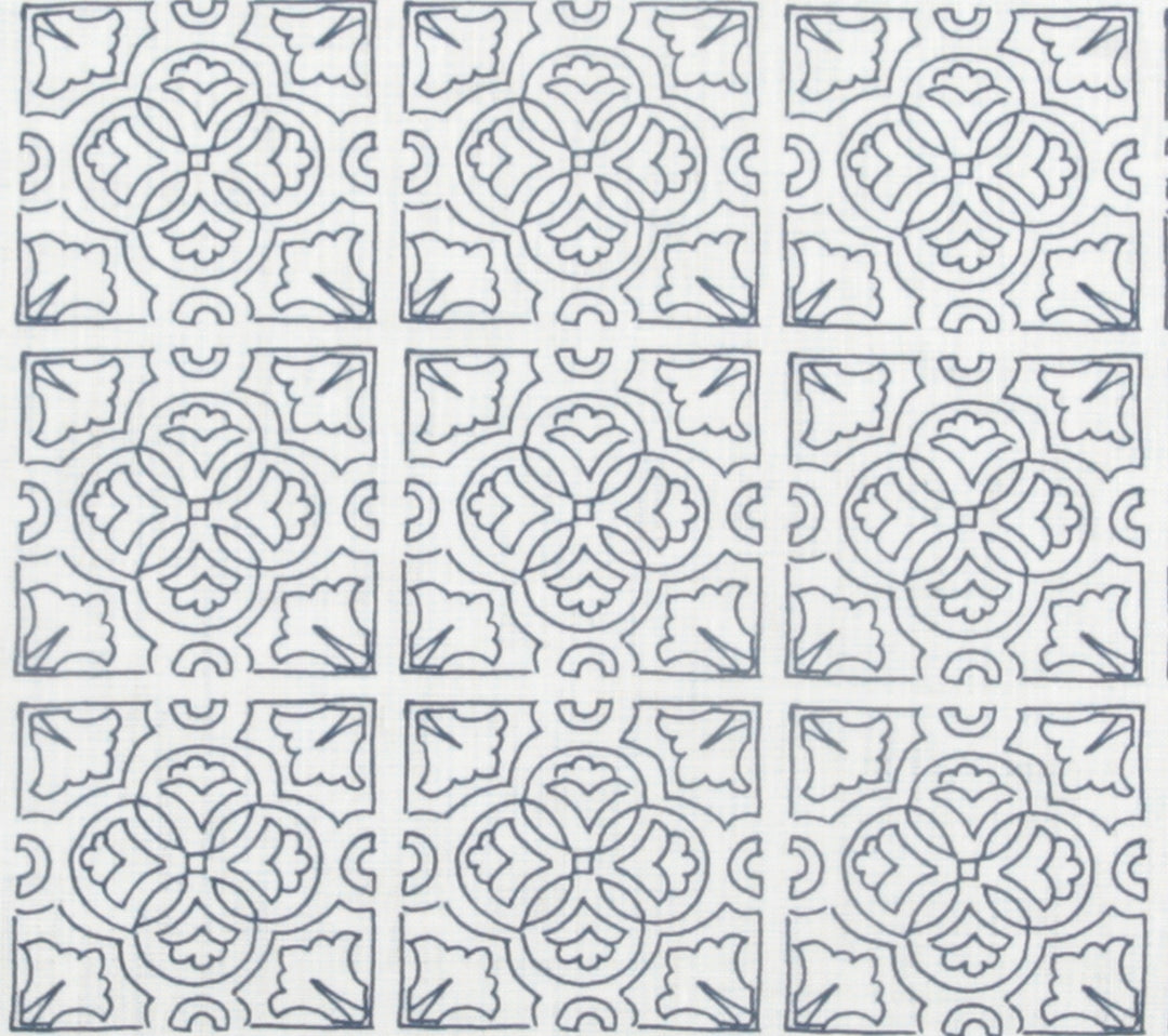 Detail of fabric in a damask lattice print in navy on a white field.