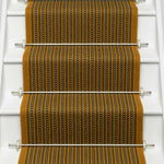 Striped flatweave runner in mustard black and ivory on white staircase