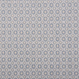 Broadloom carpet in a dense circle lattice with small floral accents in ecru on a blue field.