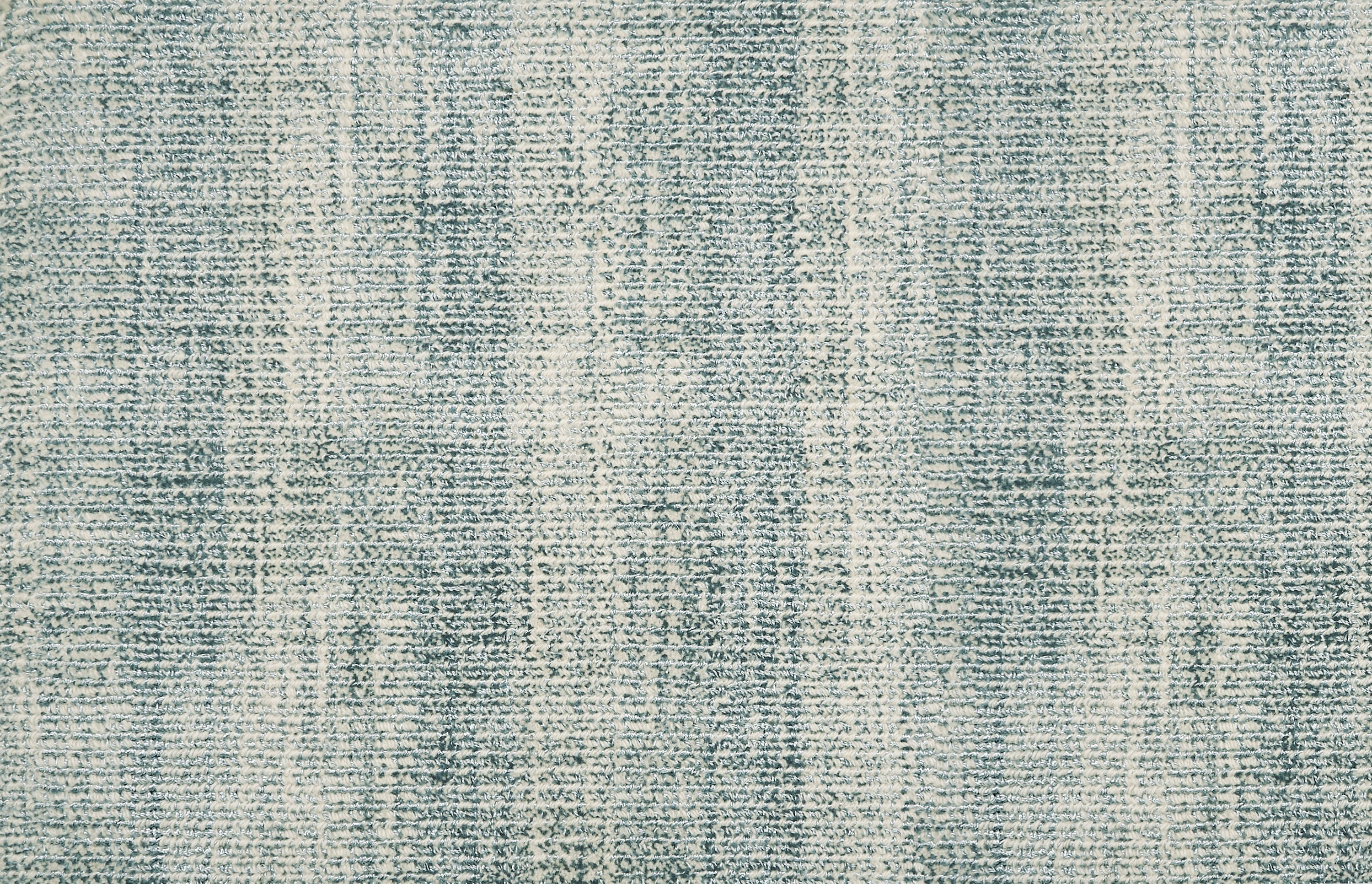 Broadloom carpet with textural weave in cream and turquoise blue.