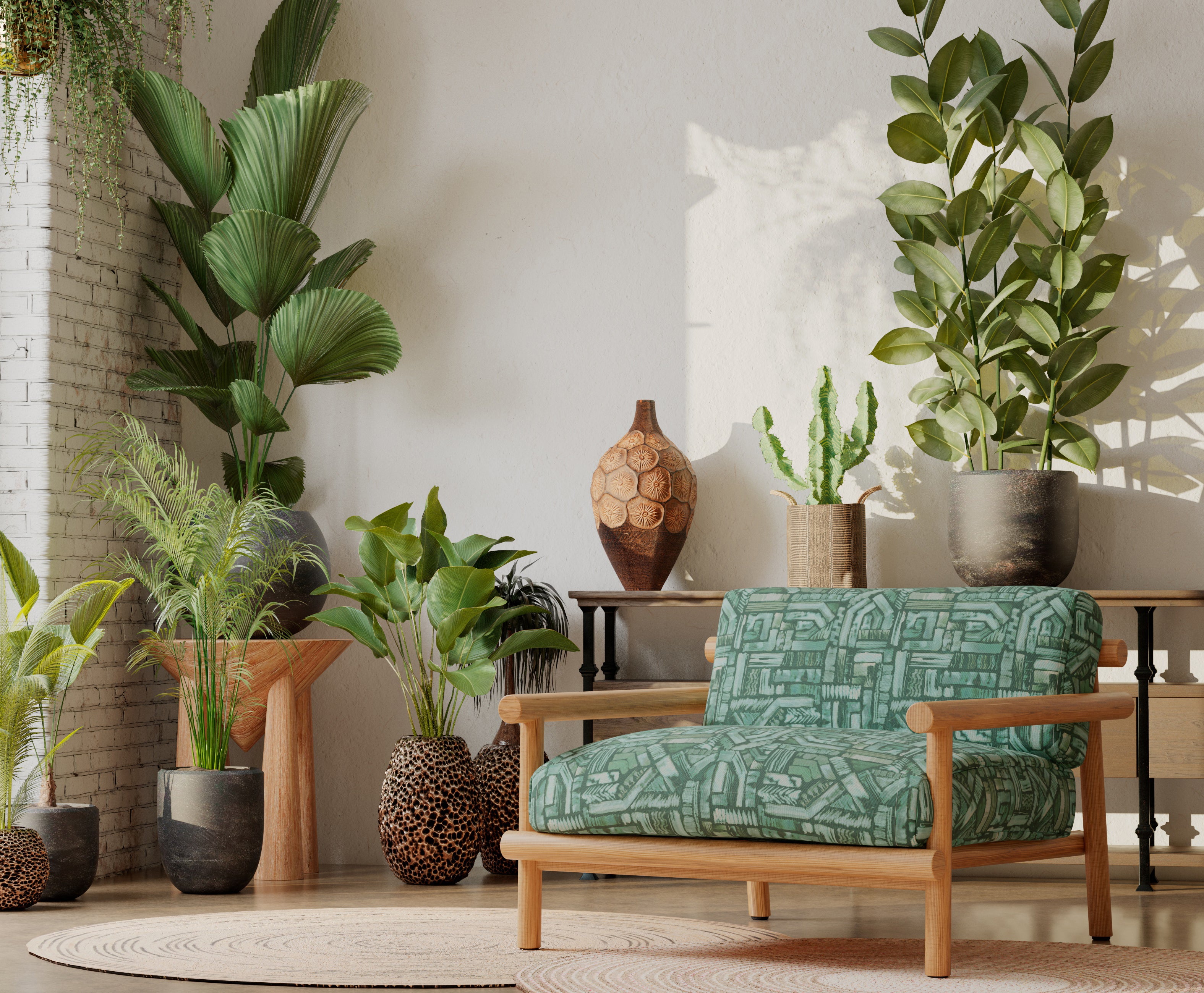 A plant-filled living space with an armchair upholstered in an abstract geometric pattern in shades of green.