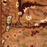 Close-up of a patterned rug with floral and leaf designs on a brown background