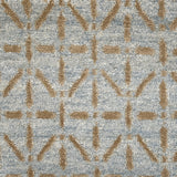Handknotted rug with tan linear design on a light blue field. 