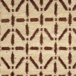 Handknotted rug with brown linear design on a cream field. 