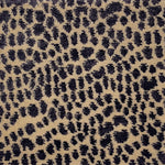 Handknotted rug with animal skin motif in purple on cream. 