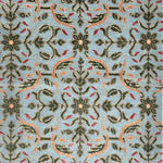 Decorative rug with intricate pattern on a blue background