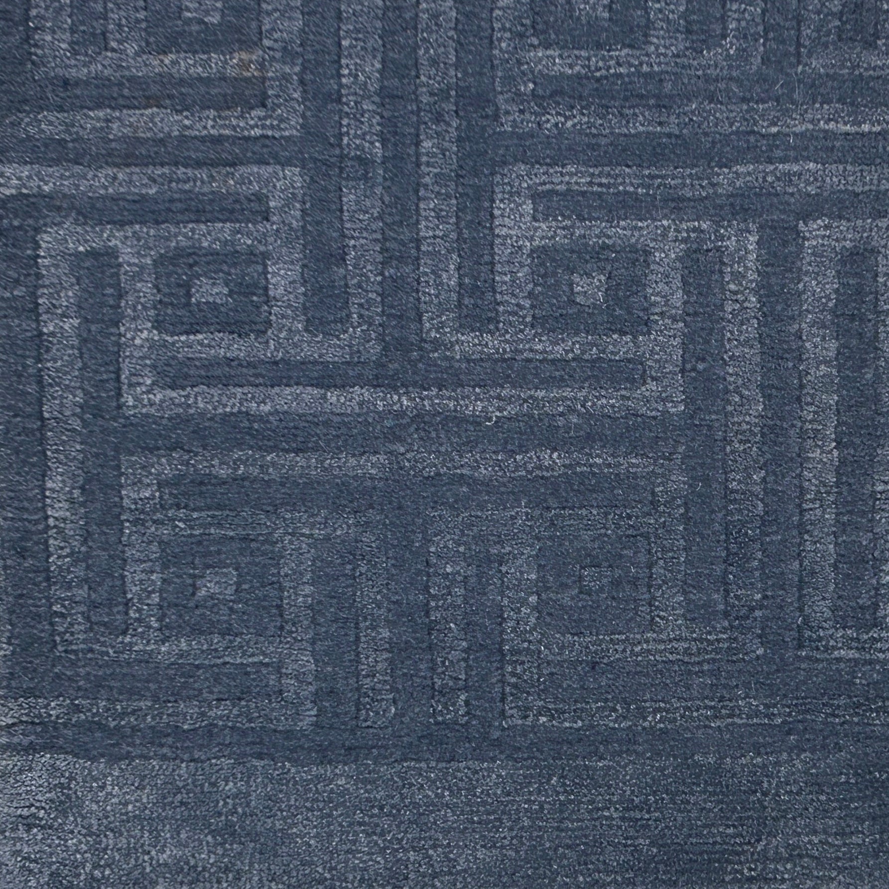 Handknotted rug with tonal greek key pattern in blue. 
