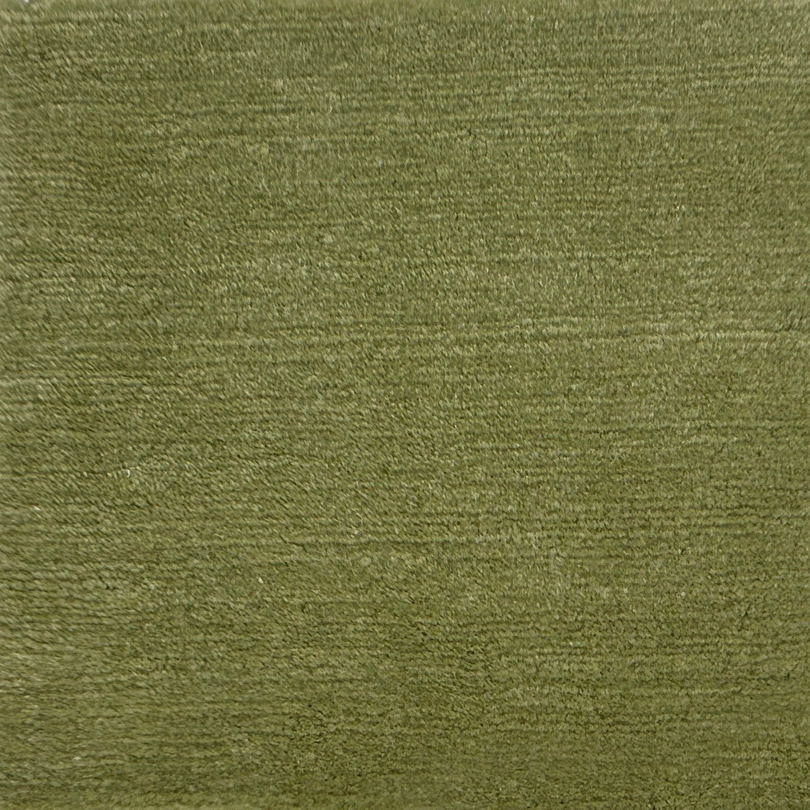 Handknotted rug with cut pile in solid green