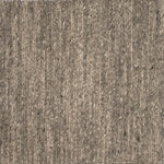 Close up of a carpet with a herringbone weave in heather grey.