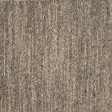 Close up of a carpet with a herringbone weave in heather grey.