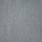 Close up of a carpet with a herringbone weave in light blue.