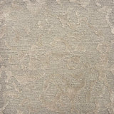 Handknotted rug sample in an organic abstract pattern in soft grey.