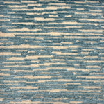 Handknotted rug sample in a textural linear design in turquoise on a cream field.