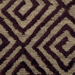 Close-up of a handknotted rug with a purple geometric pattern on a beige background