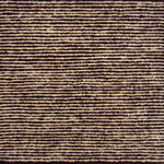 A close-up of a textured striped handknotted carpet with alternating horizontal bands of dark red and warm beige.