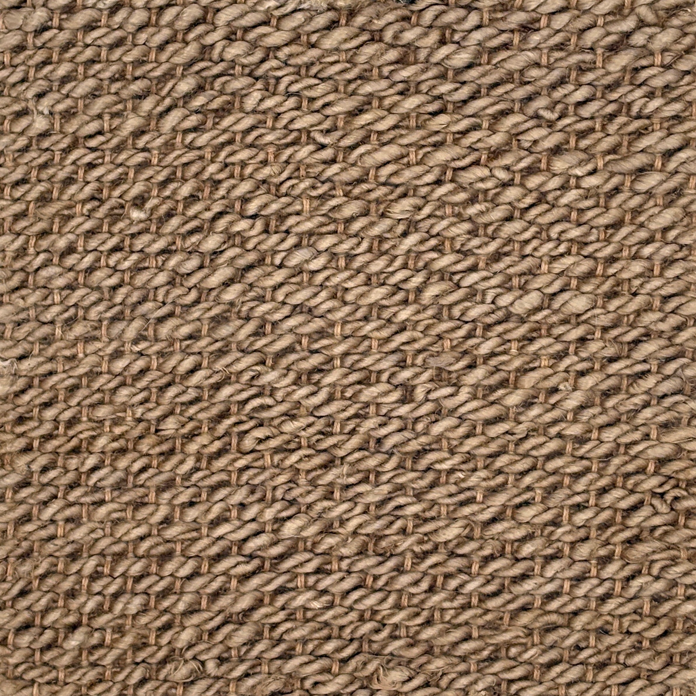 Close-up of a textured brown fabric carpet