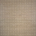 Patterned rug with geometric design on a beige background