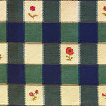 Blue, greena nd cream checkered fabric with floral patterns in alternating squares.