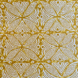 Detail of fabric in a botanical geometric print in shades of brown, yellow and white.