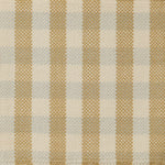 Flatwoven rug in a green, cream and pale blue plaid.