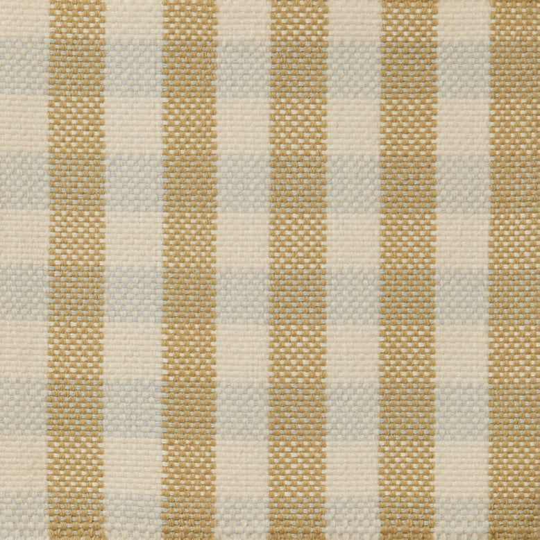 Flatwoven rug in a green, cream and pale blue plaid.