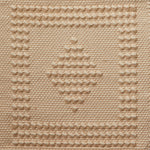 Flatwoven rug with a raised border and diamond design in tan and cream.