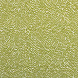 Detail of fabric in a scrolling stem and leaf print in lime on a cream field.