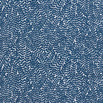 Detail of fabric in a scrolling stem and leaf print in navy on a white field.