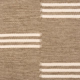 Broadloom flatweave carpet in a broken stripe in white on a brown field. 
