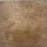 A solid rug in golden tan.