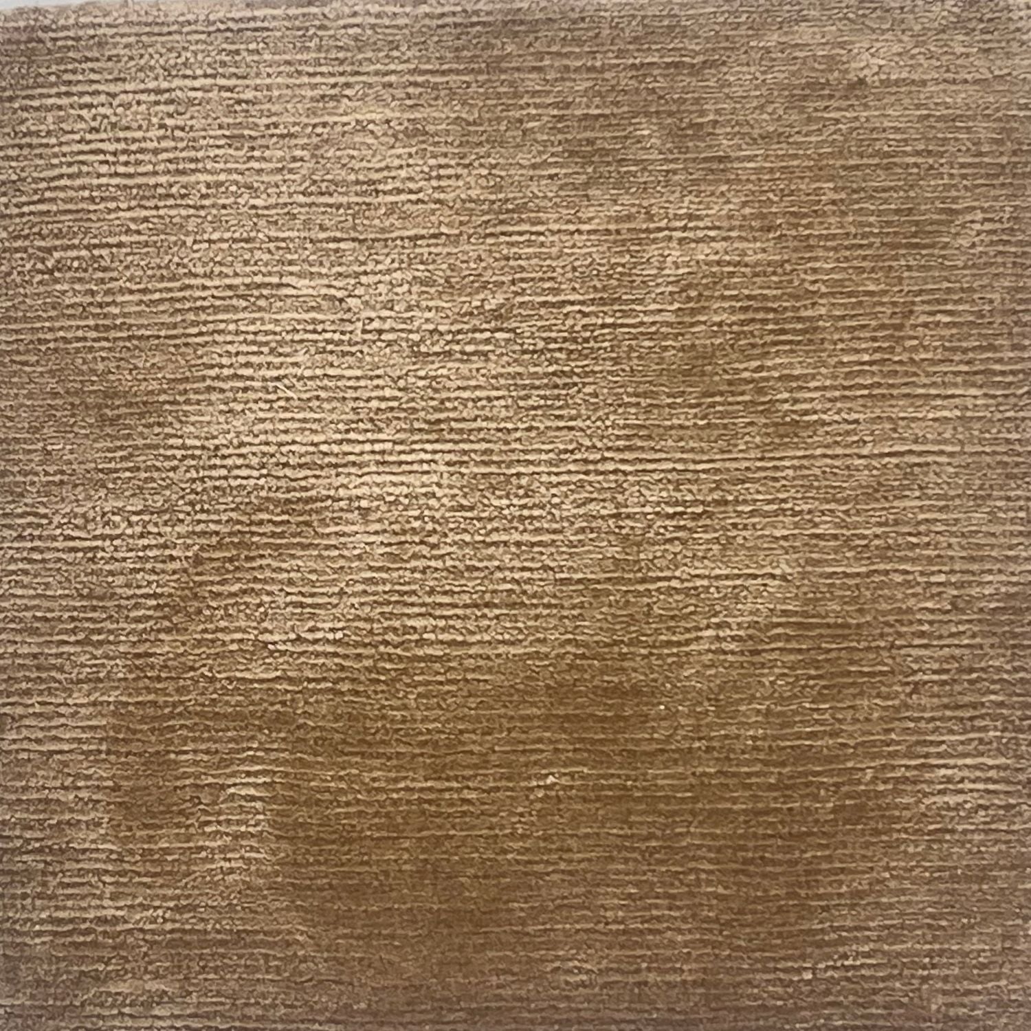 A solid rug in golden tan.