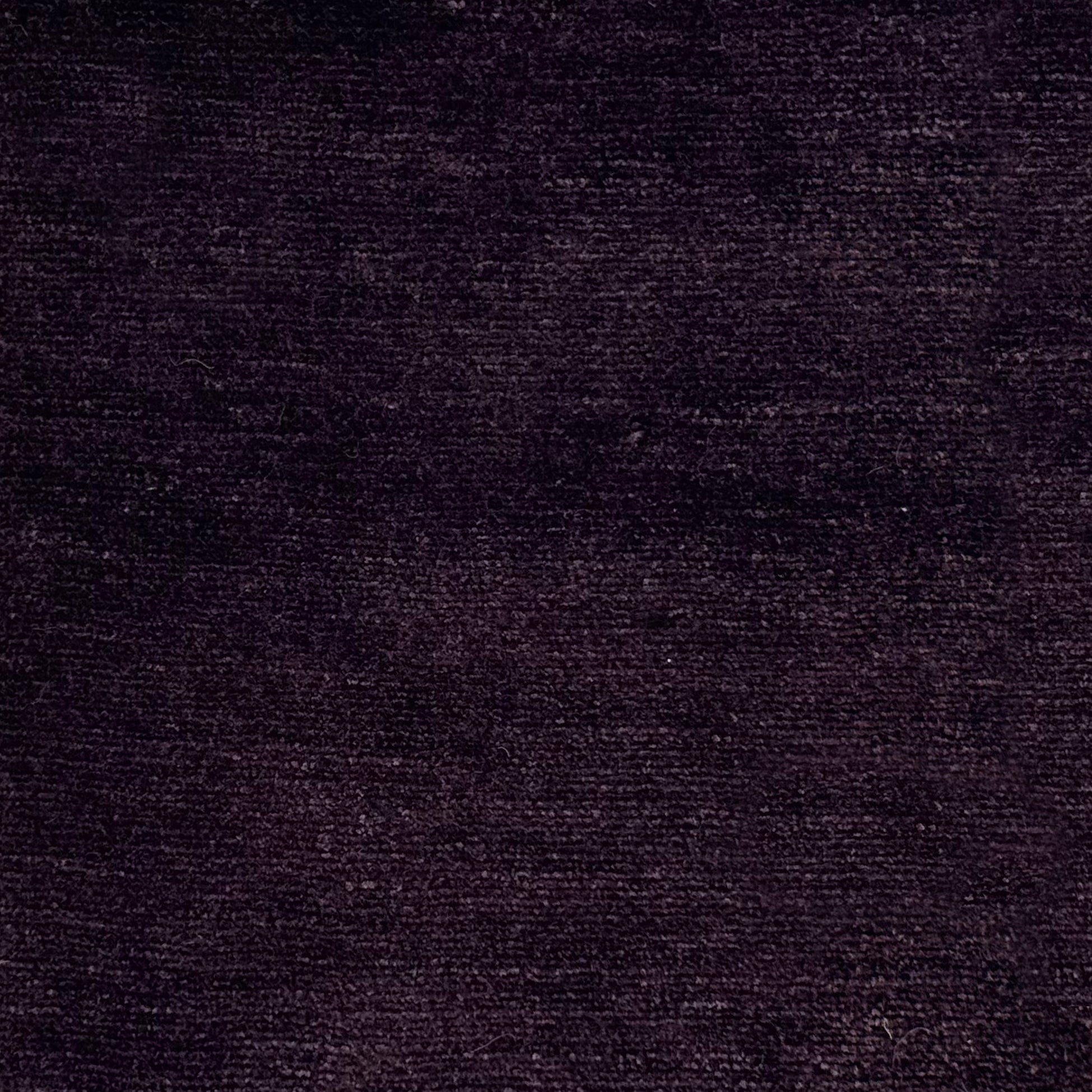 Handknotted rug in pashmina and silk in solid cut pile in dark purple.