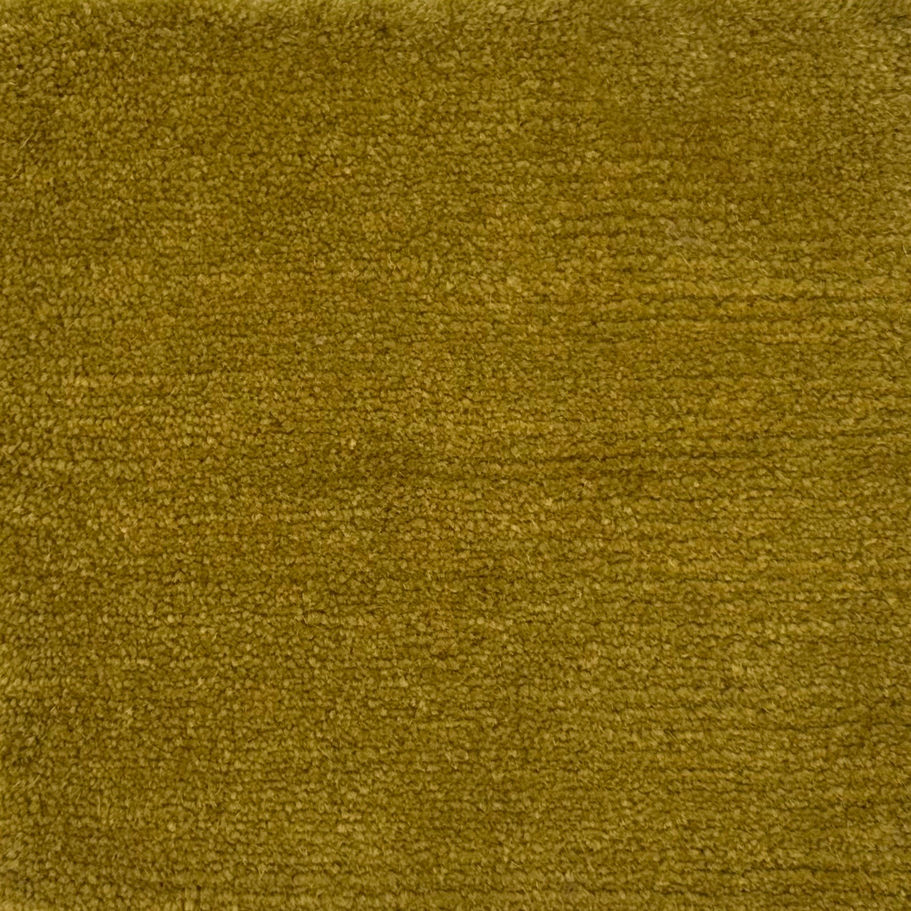Handknotted rug in wool and merino in solid cut pile in bright mustard yellow.