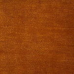 Handknotted rug in wool and merino in solid cut pile in orange.