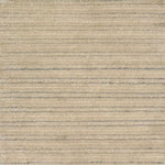 A close-up of a handknotted rug in warm beige with thin horizontal silver stripes.