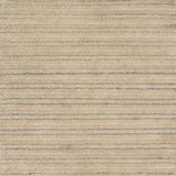 A close-up of a handknotted rug in warm beige with thin horizontal silver stripes.